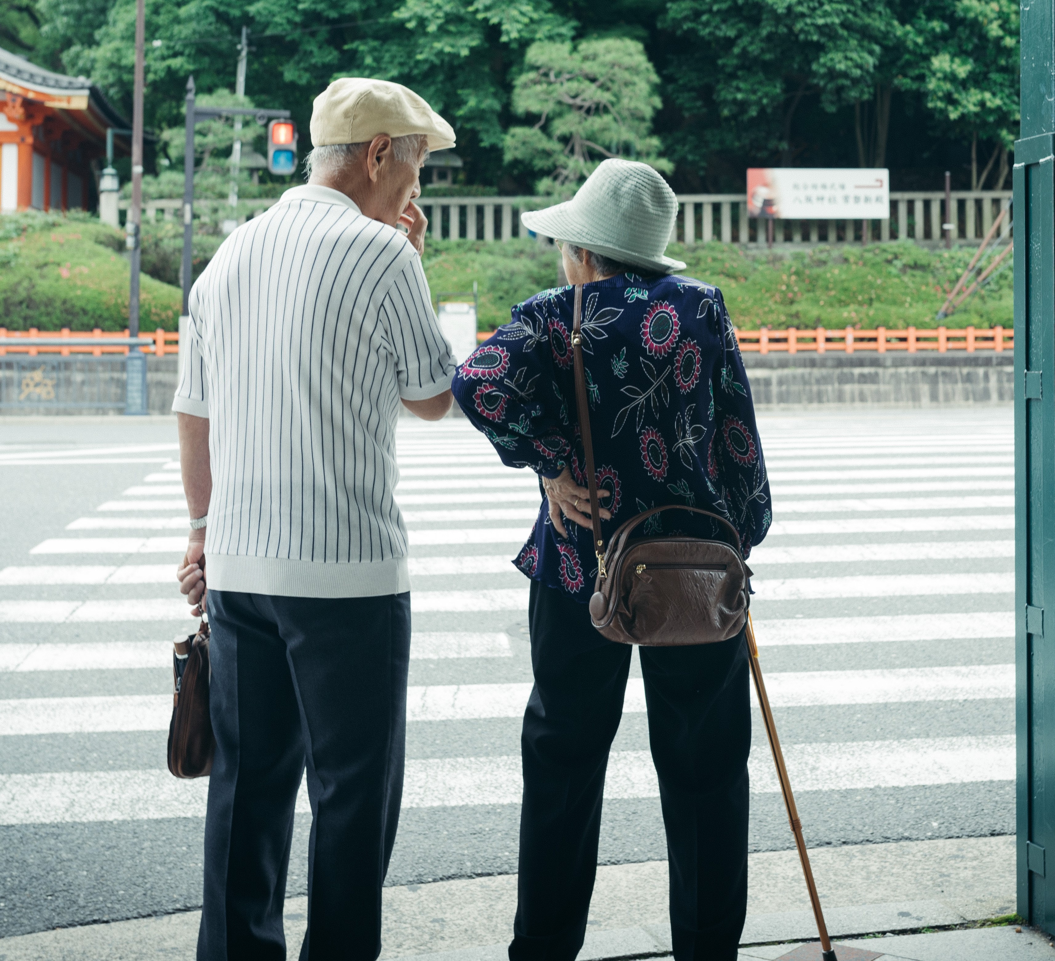 senior couple waiting to cross the street edit