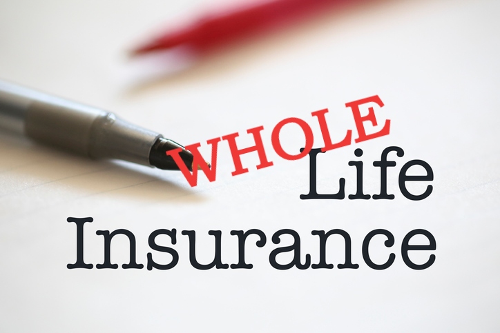 whole life insurance on desktop with pen and papers in background